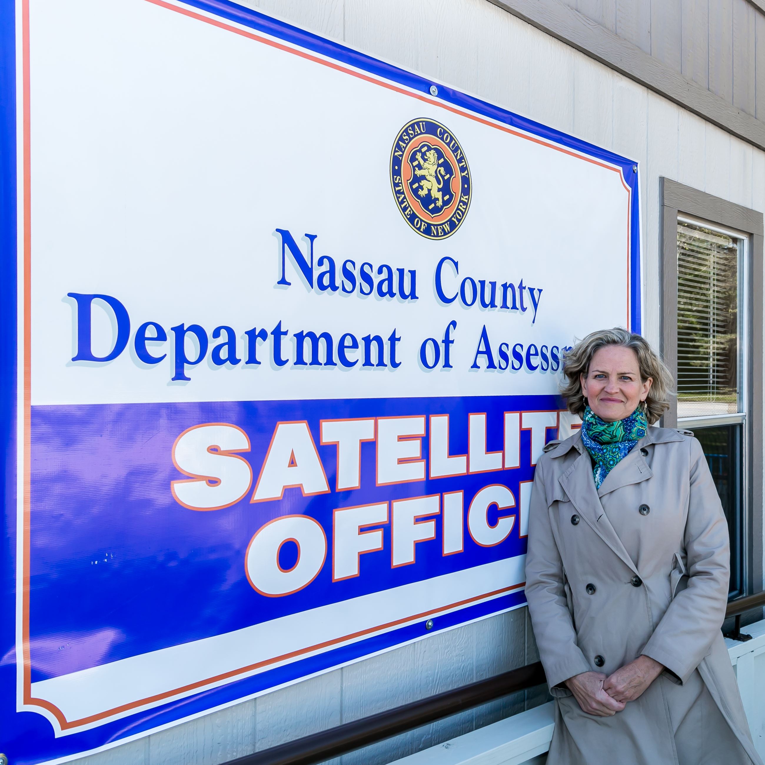 County Executive Laura Curran beside a Department of Assessment satellite office