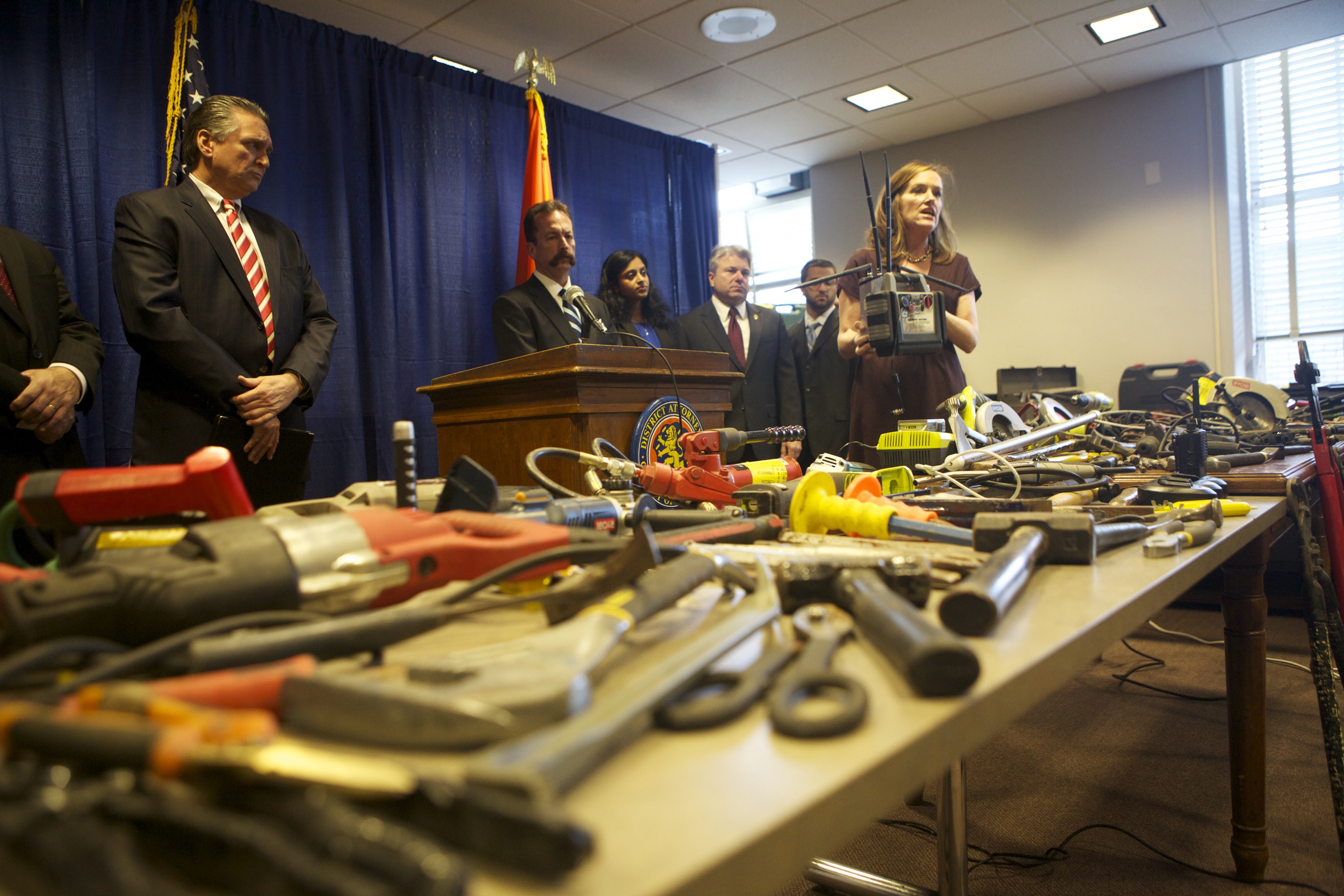 DA Rice holds a cellphone jammer used in a burglary ring